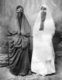 Palestine: Two young Palestinian women wearing veils, c. 1920